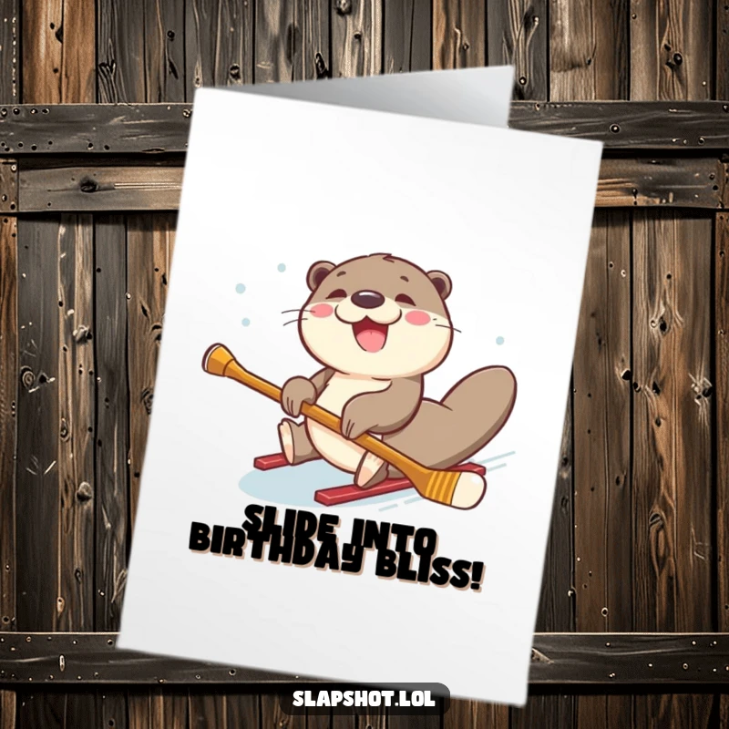 Funny Free Printable Birthday Card: Joyful otter sliding on its belly holding a hockey stick, gleefully celebrating, a hilarious DIY gift.