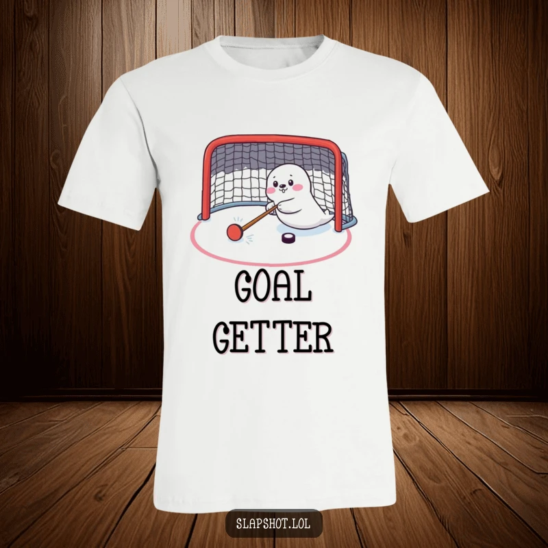 Funny seal enthusiastically shooting a hockey puck towards a net, printed on a t-shirt, ideal for hockey fans.